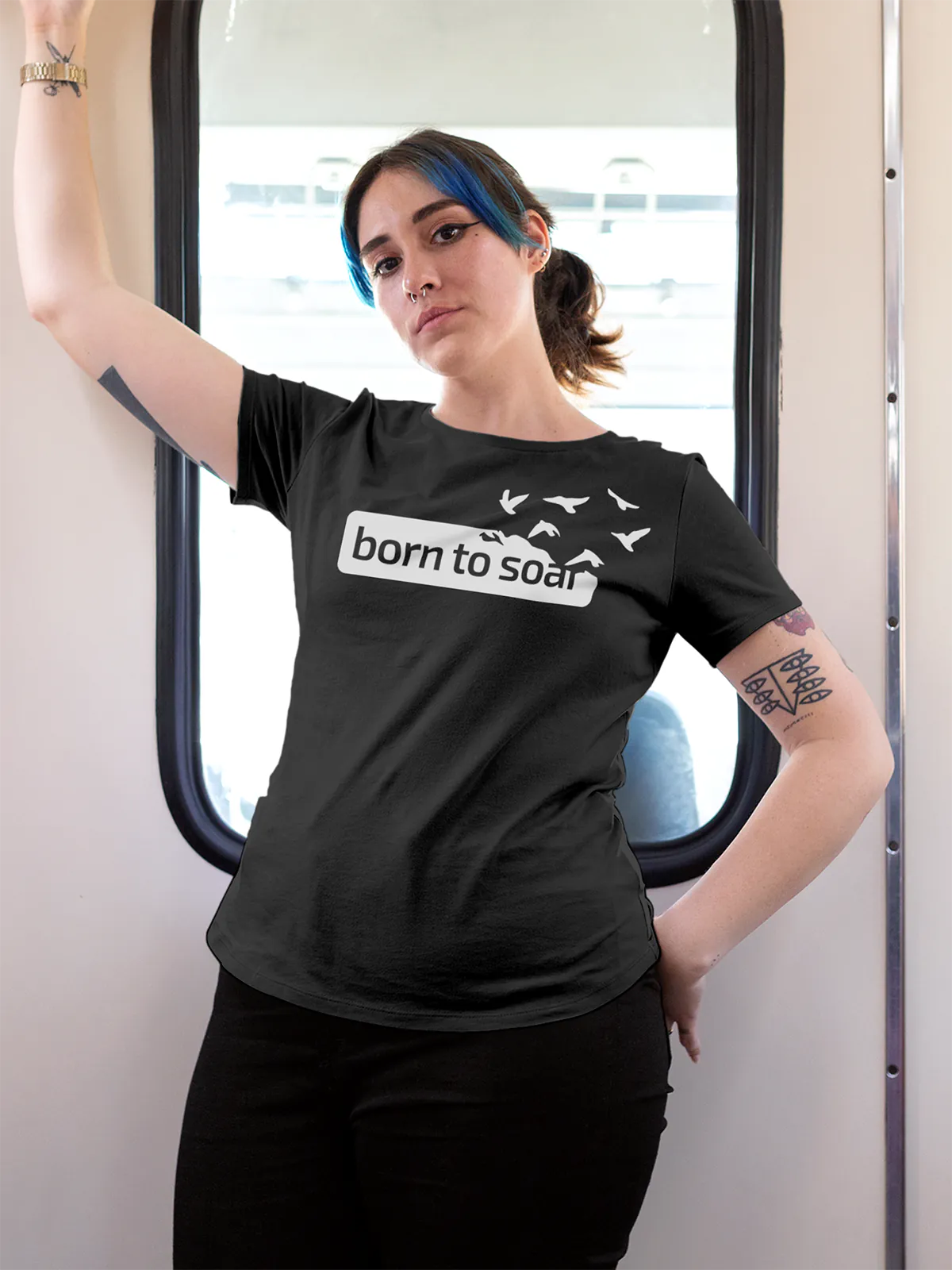 Model wearing Women's Dark Grey Round Neck T-shirt with 'Born To Soar' design, offering effortless style and premium comfort