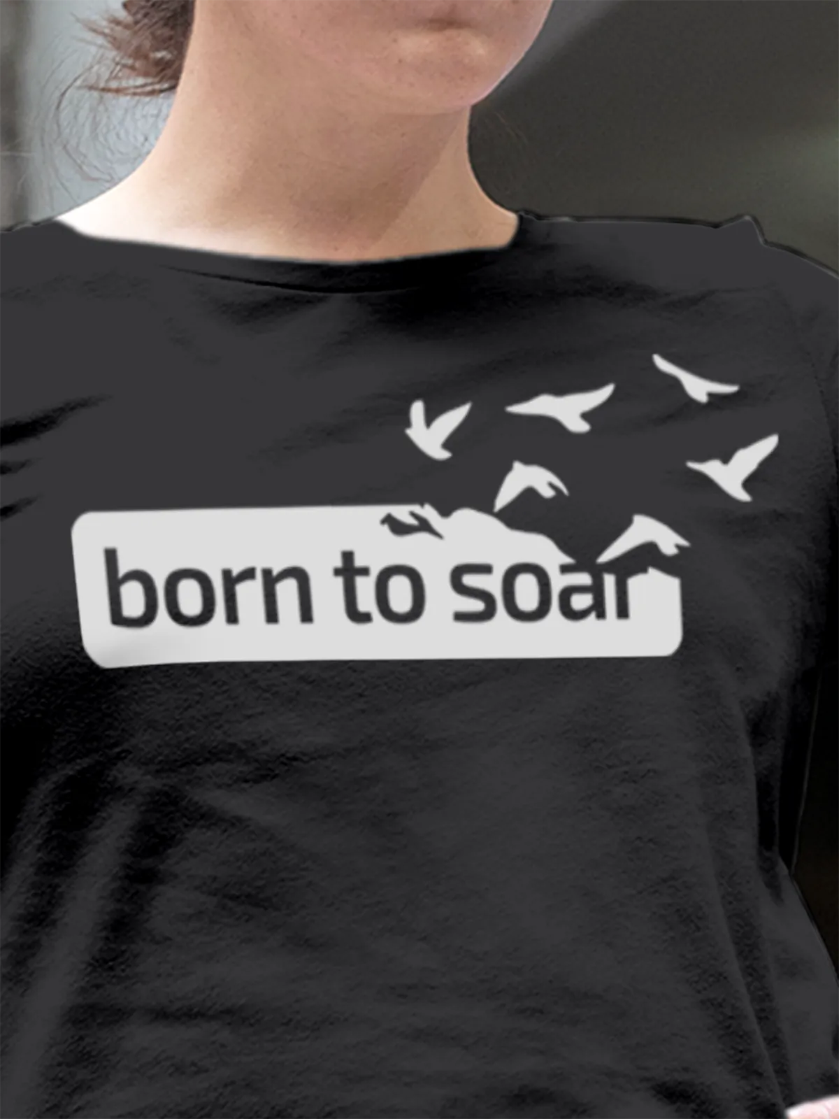 Close up of 'Born To Soar' design on Women's Dark Grey Round Neck T-shirt, highlighting intricate details and vibrant print.
