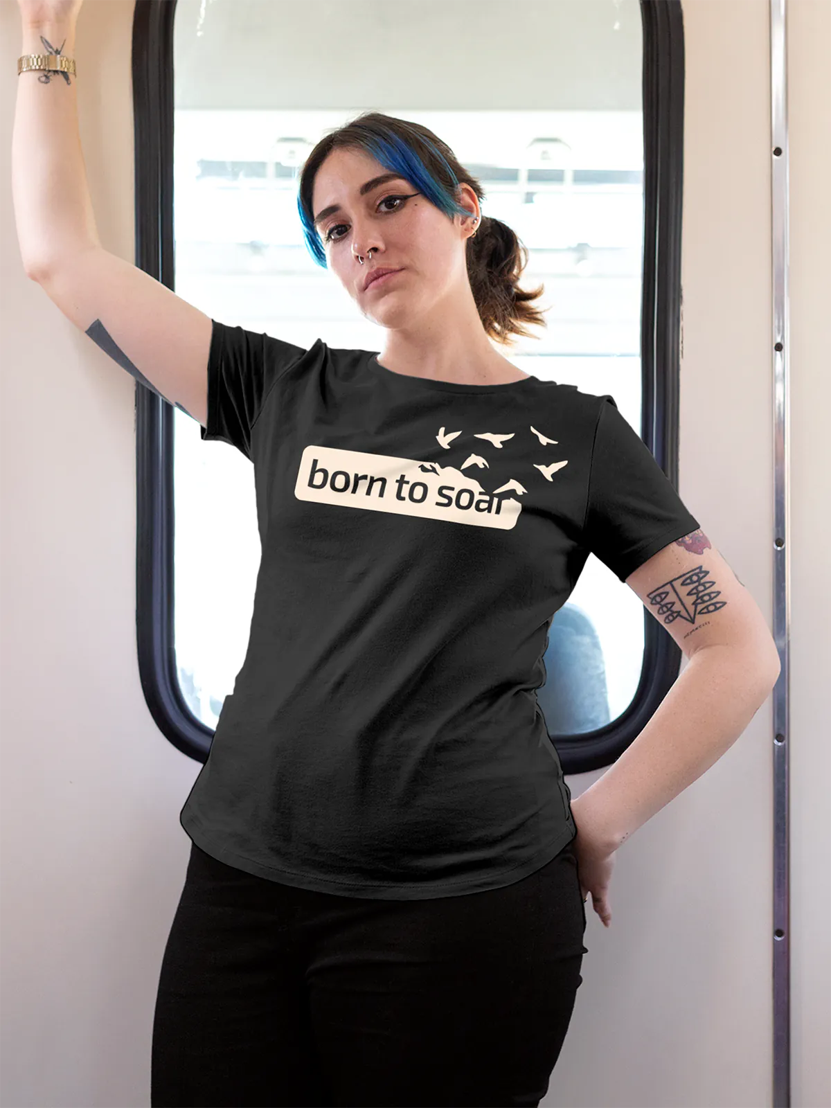 Model wearing Women's Dark Grey Round Neck T-shirt with 'Born To Soar' design, offering effortless style and premium comfort