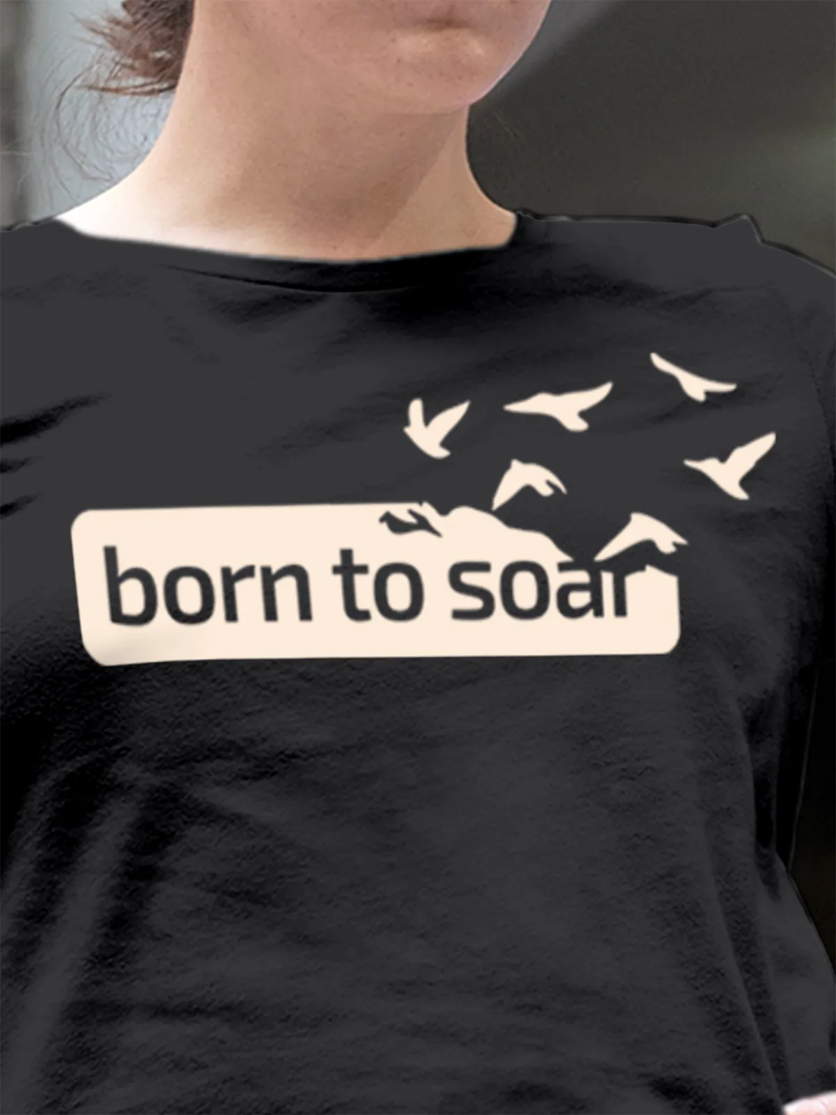 Close up of 'Born To Soar' design on Women's Dark Grey Round Neck T-shirt, highlighting intricate details and vibrant print.