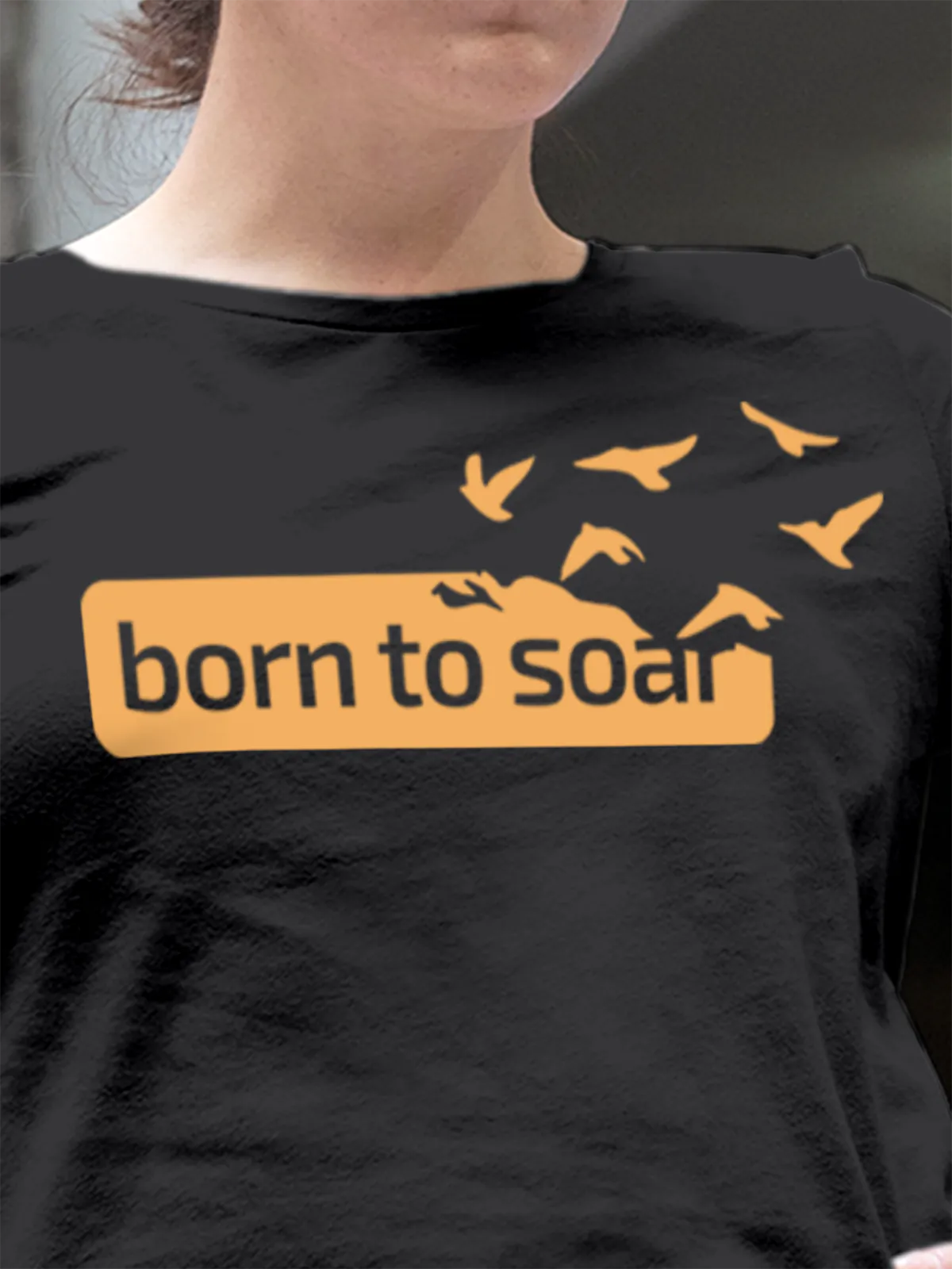 Close up of 'Born To Soar' design on Women's Dark Grey Round Neck T-shirt, highlighting intricate details and vibrant print.
