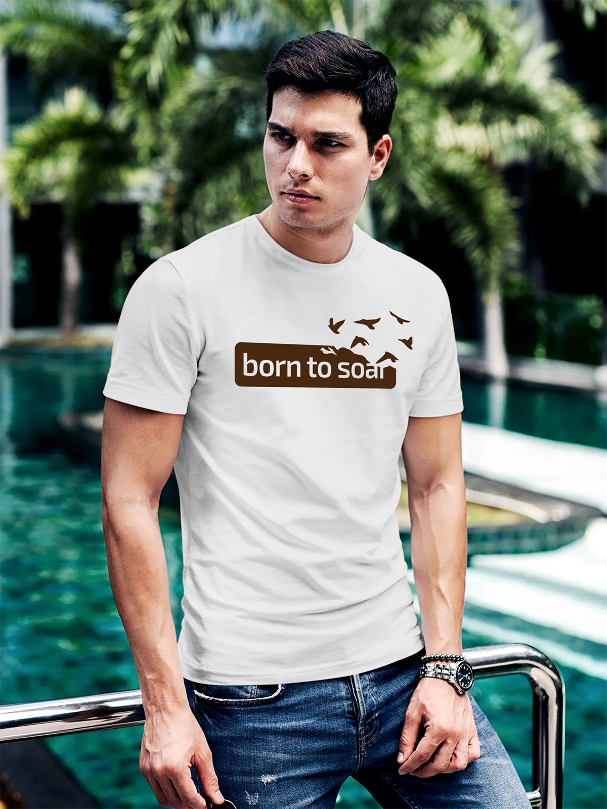 Model wearing Men's White Round Neck T-shirt with 'Born To Soar' design, offering effortless style and premium comfort