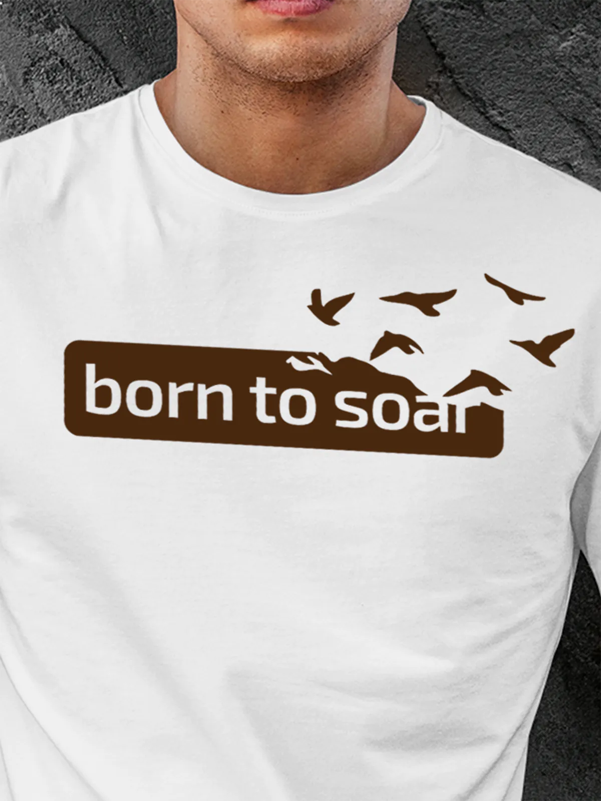 Close up of 'Born To Soar' design on Men's White Round Neck T-shirt, highlighting intricate details and vibrant print.
