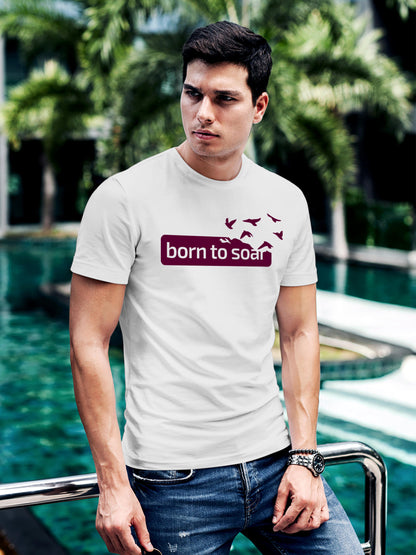 Model wearing Men's White Round Neck T-shirt with 'Born To Soar' design, offering effortless style and premium comfort