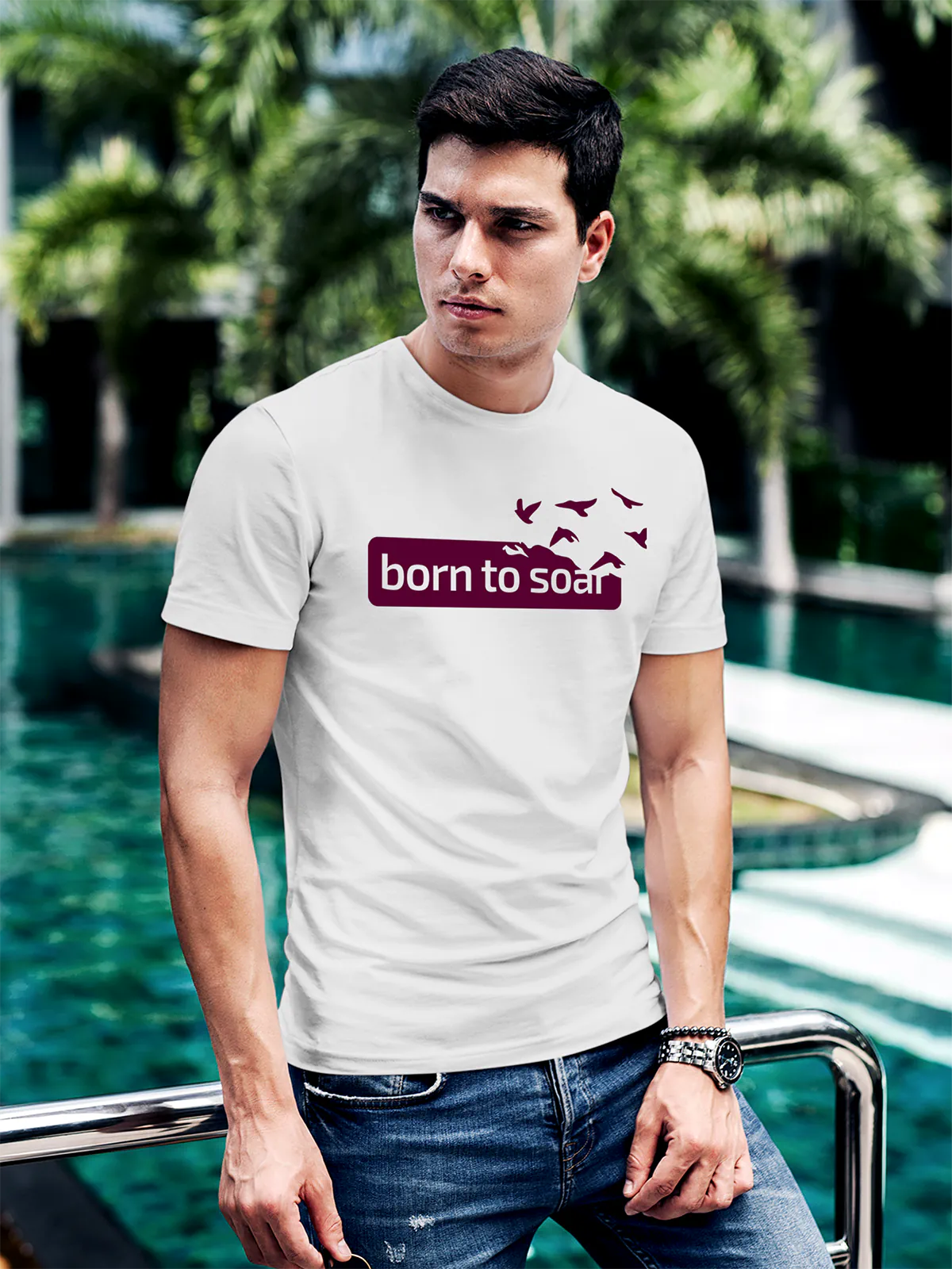 Model wearing Men's White Round Neck T-shirt with 'Born To Soar' design, offering effortless style and premium comfort