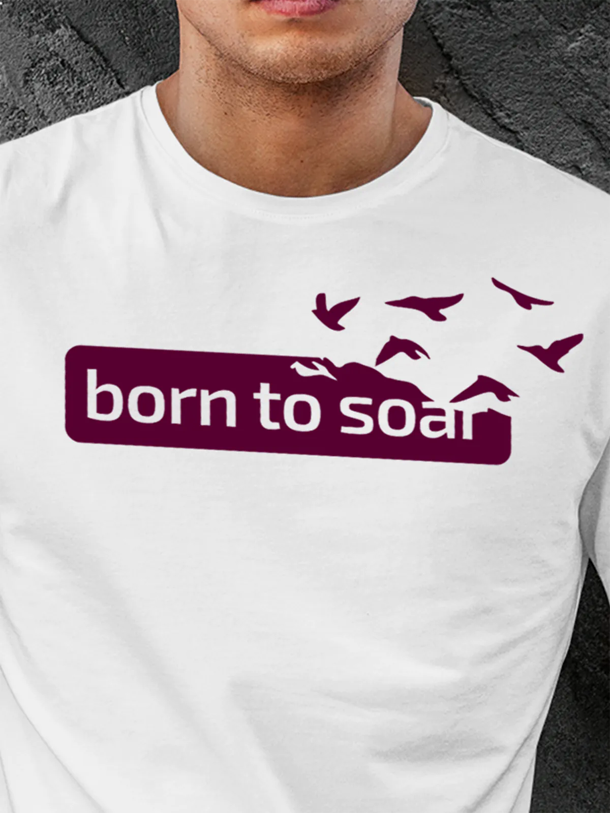 Close up of 'Born To Soar' design on Men's White Round Neck T-shirt, highlighting intricate details and vibrant print.