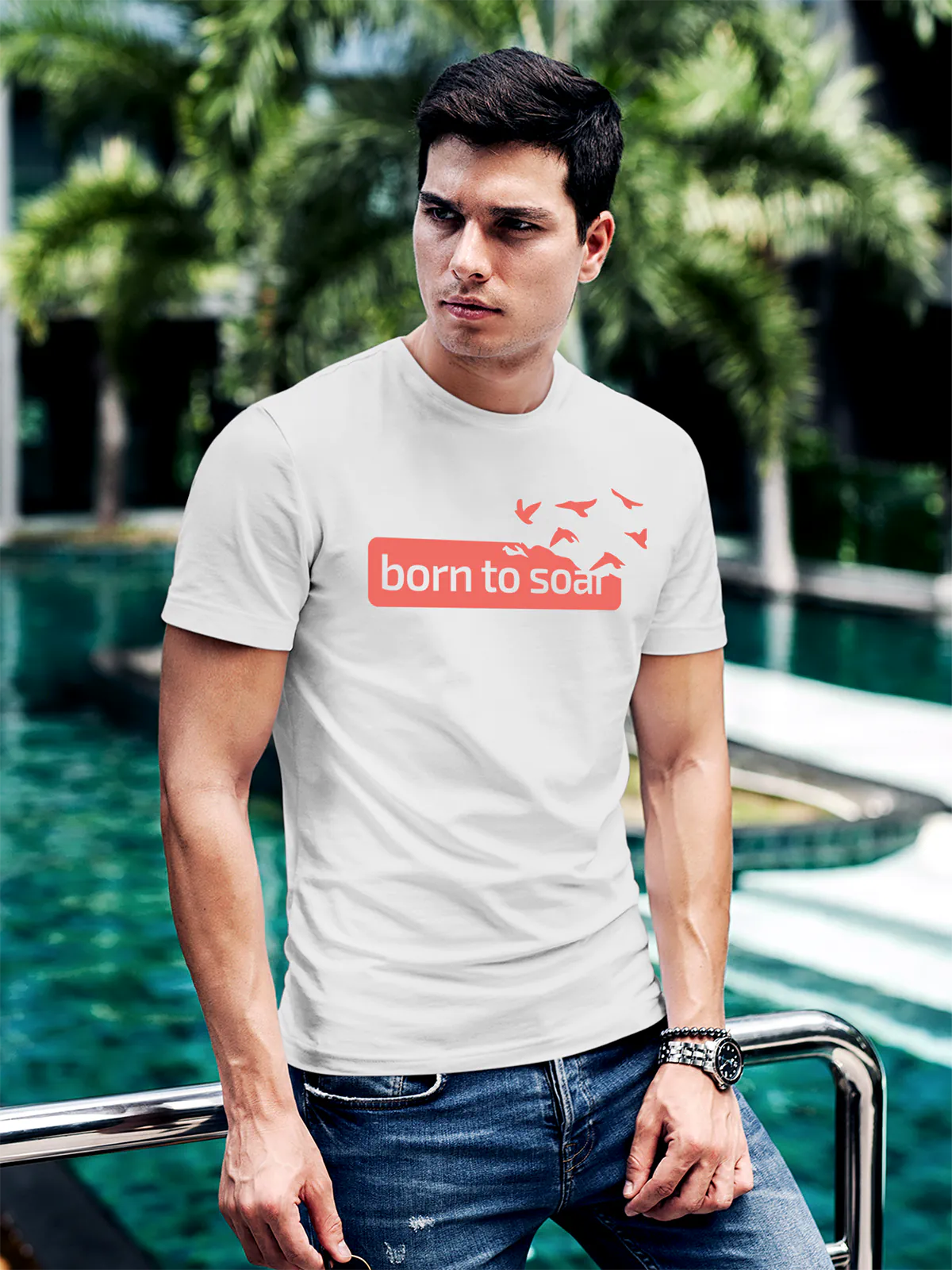 Model wearing Men's White Round Neck T-shirt with 'Born To Soar' design, offering effortless style and premium comfort
