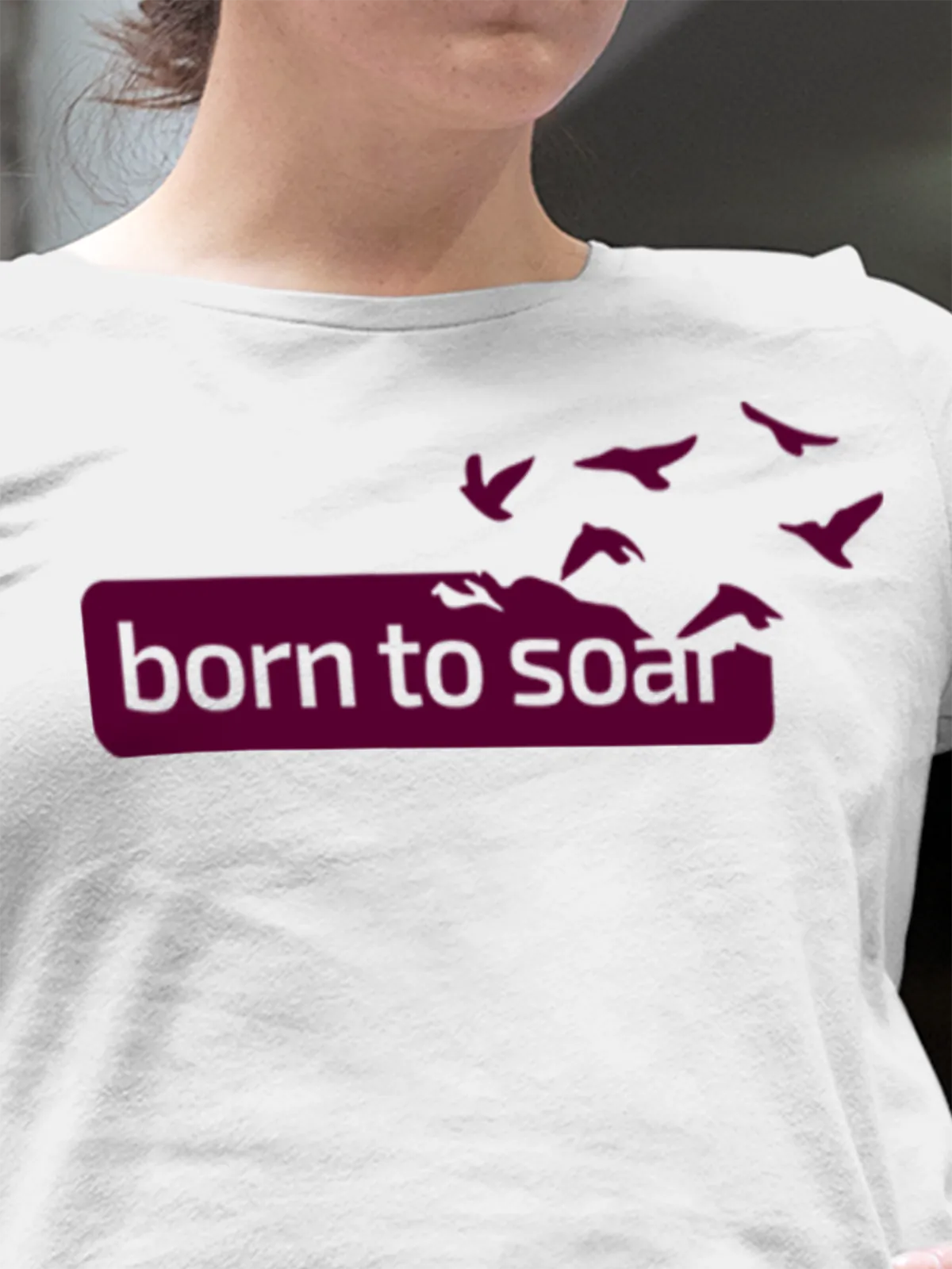 Close up of 'Born To Soar' design on Women's White Round Neck T-shirt, highlighting intricate details and vibrant print.