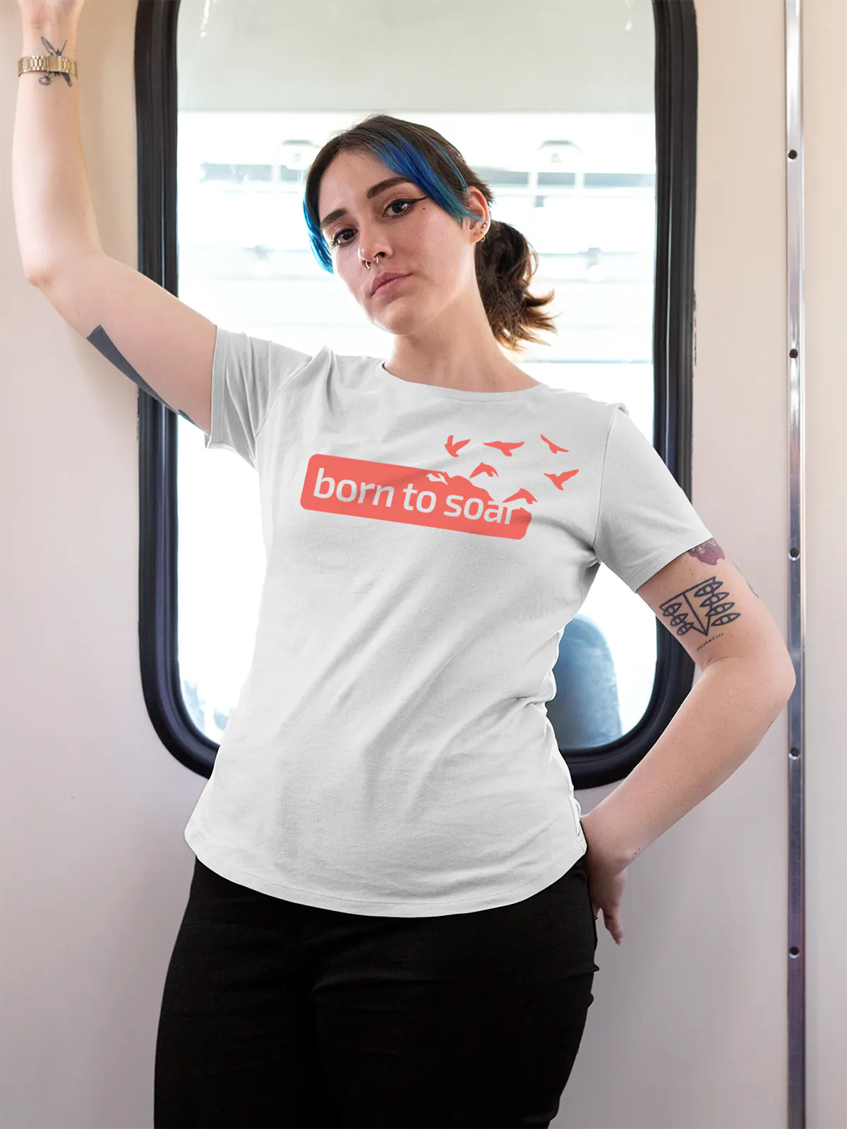 Model wearing Women's White Round Neck T-shirt with 'Born To Soar' design, offering effortless style and premium comfort