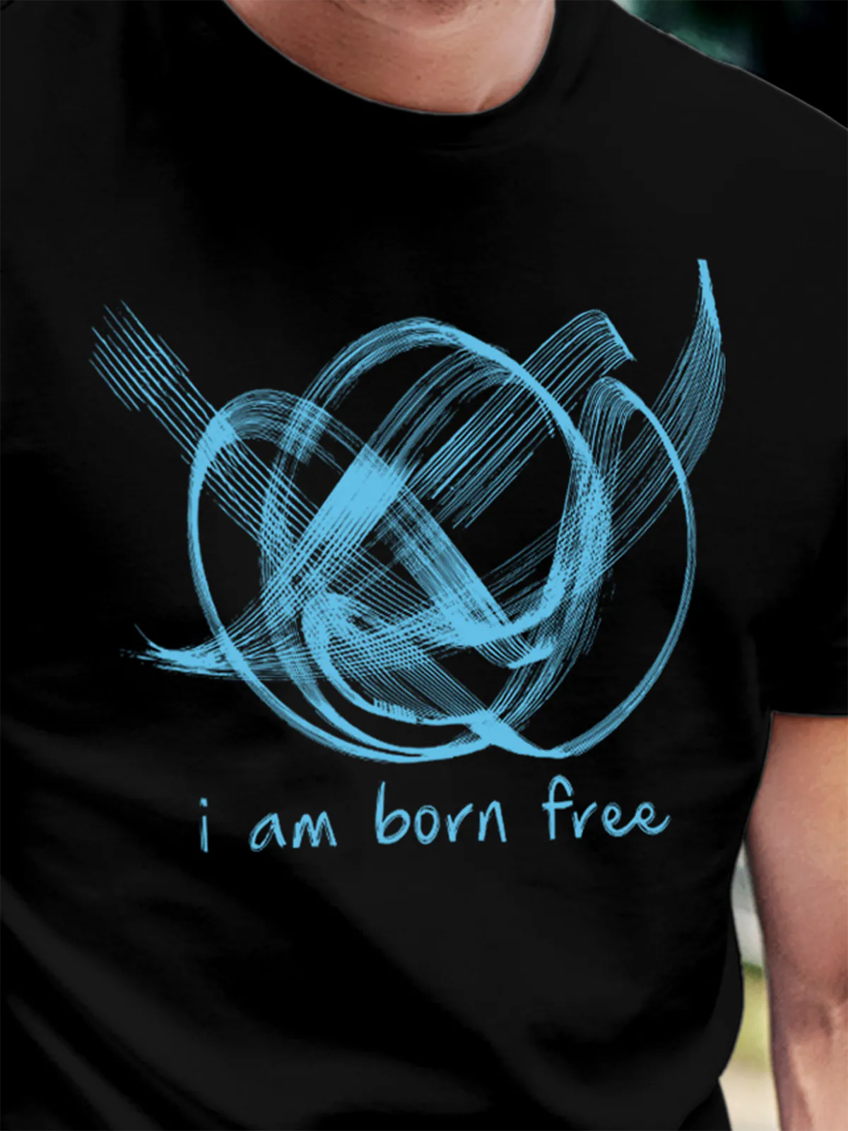 Close up of 'Born Free' design on Men's Black Round Neck T-shirt, highlighting intricate details and vibrant print.