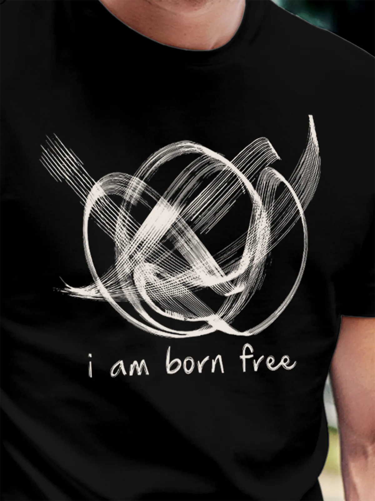 Close up of 'Born Free' design on Men's Black Round Neck T-shirt, highlighting intricate details and vibrant print.