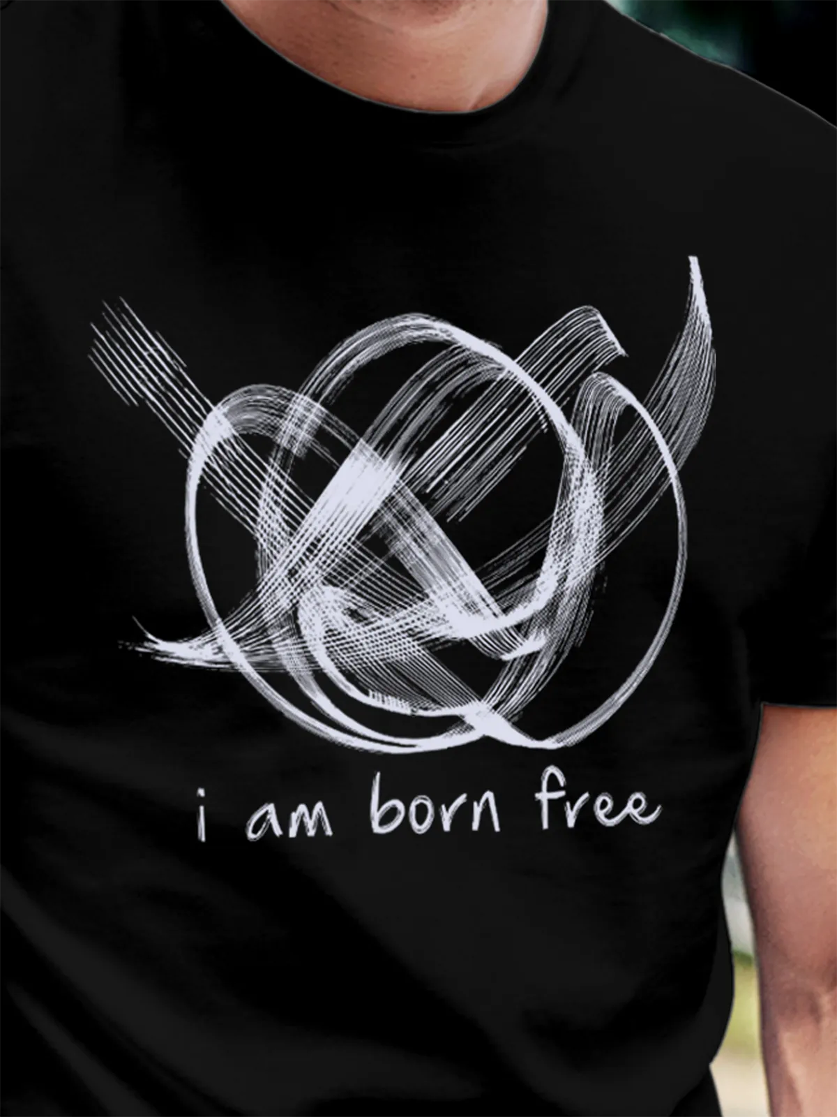 Close up of 'Born Free' design on Men's Black Round Neck T-shirt, highlighting intricate details and vibrant print.