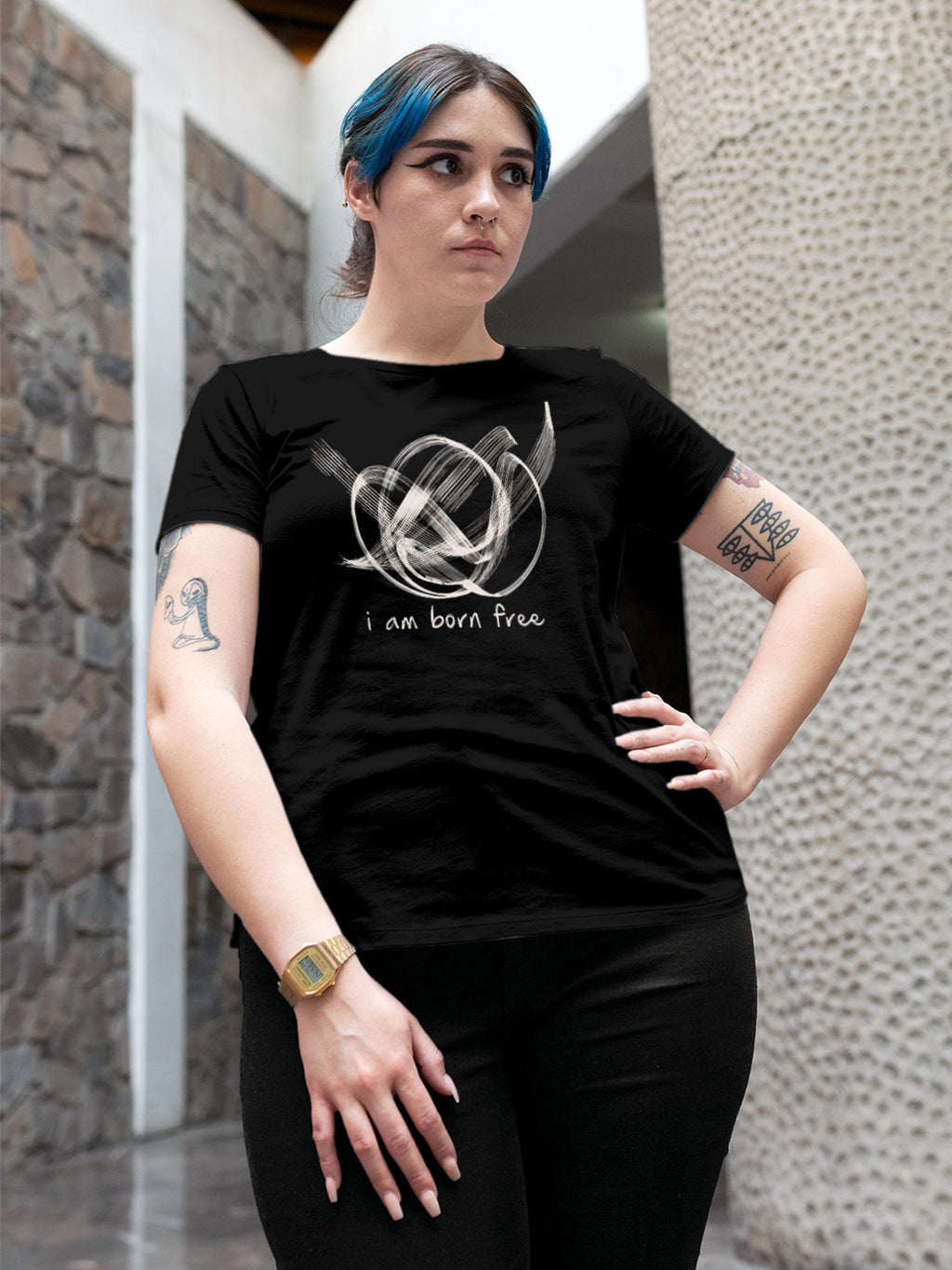 Model wearing Women's Black Round Neck T-shirt with 'Born Free' design, offering effortless style and premium comfort