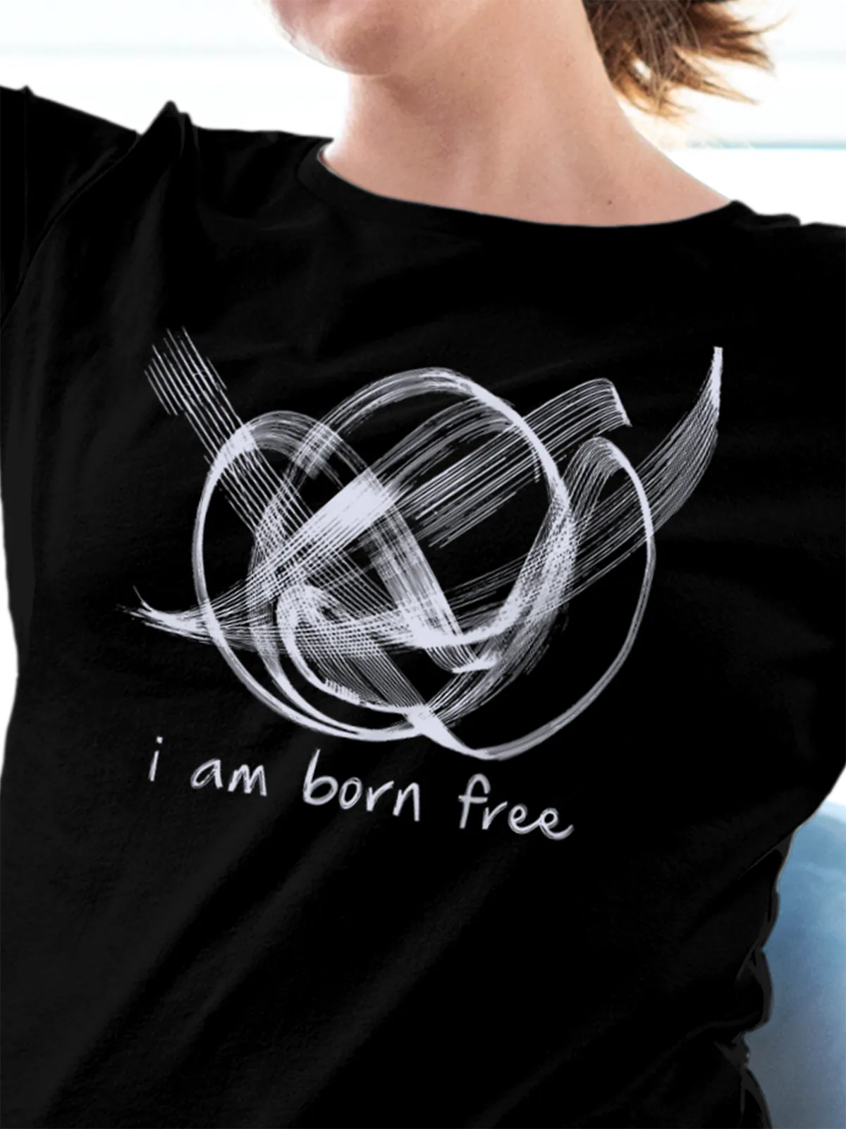 Close up of 'Born Free' design on Women's Black Round Neck T-shirt, highlighting intricate details and vibrant print.