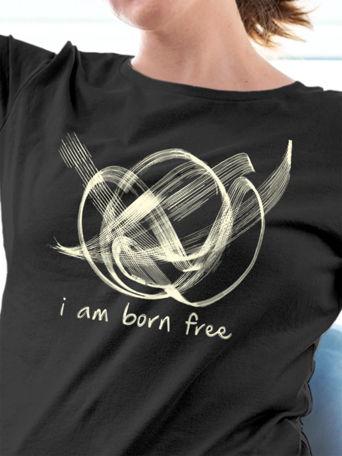 Close up of 'Born Free' design on Women's Dark Grey Round Neck T-shirt, highlighting intricate details and vibrant print.