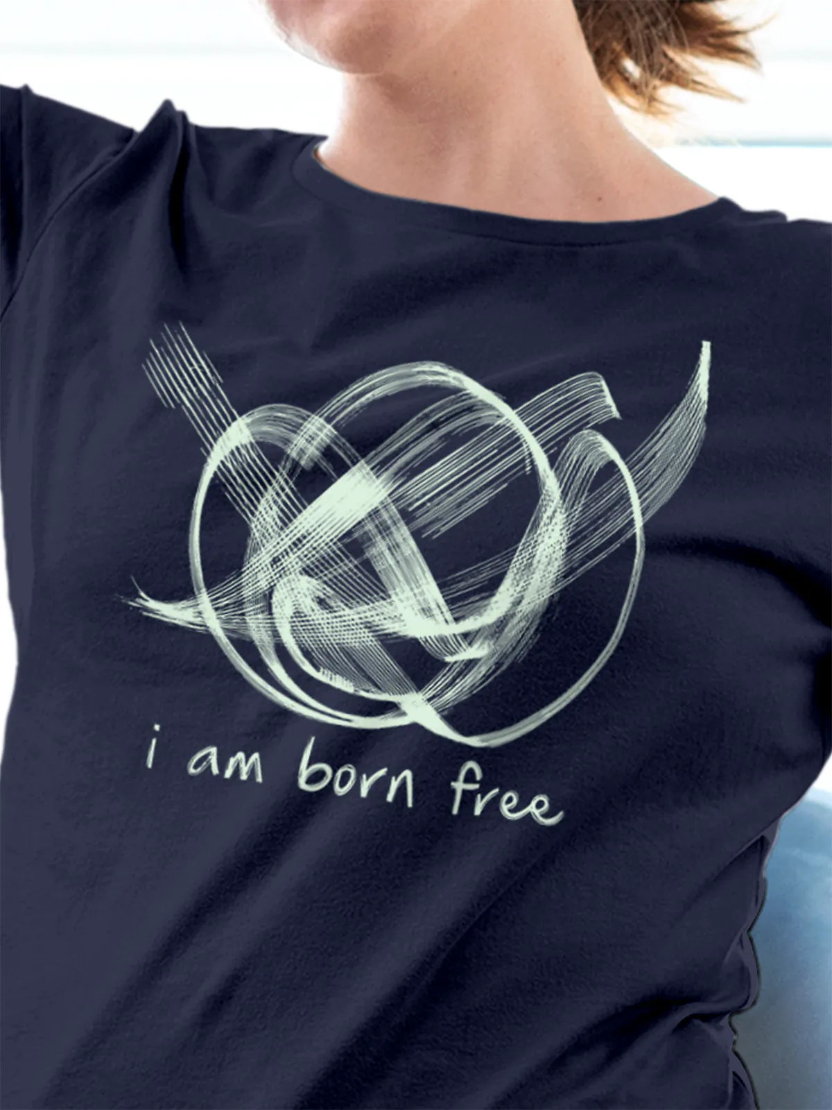 Close up of 'Born Free' design on Women's Navy Blue Round Neck T-shirt, highlighting intricate details and vibrant print.