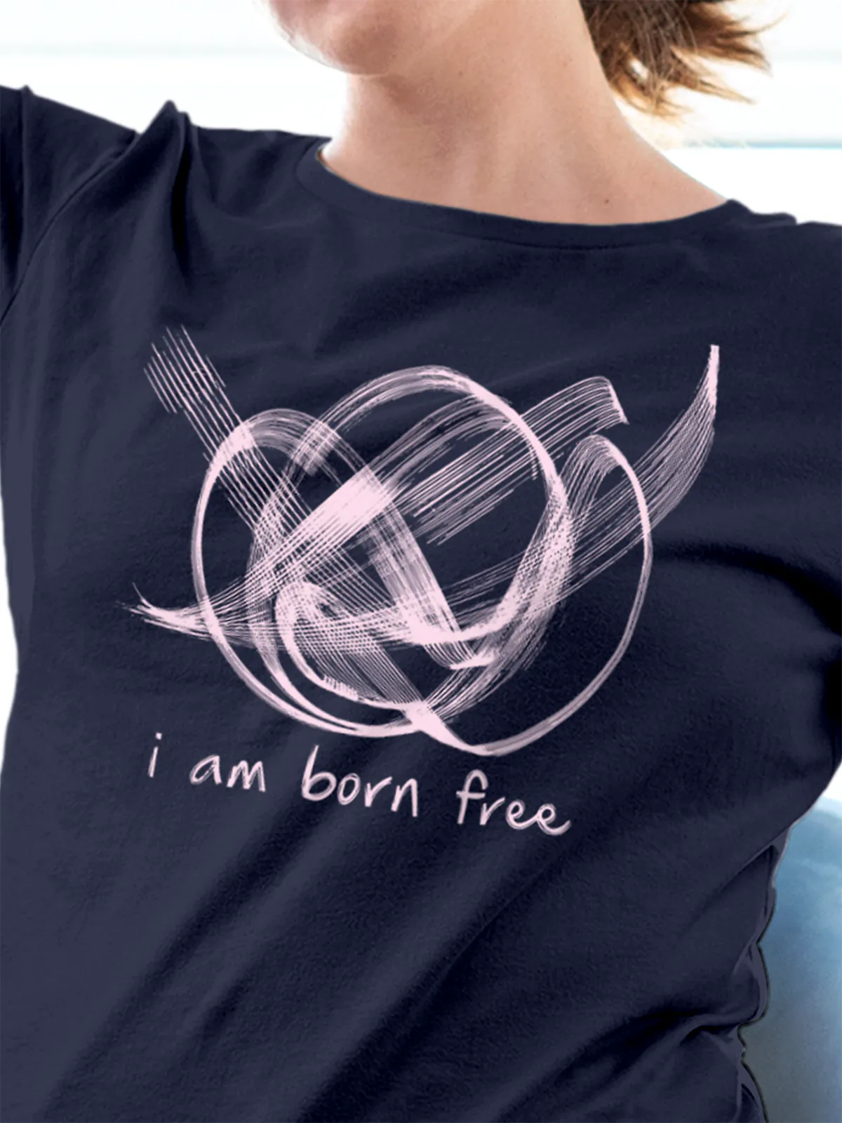 Close up of 'Born Free' design on Women's Navy Blue Round Neck T-shirt, highlighting intricate details and vibrant print.