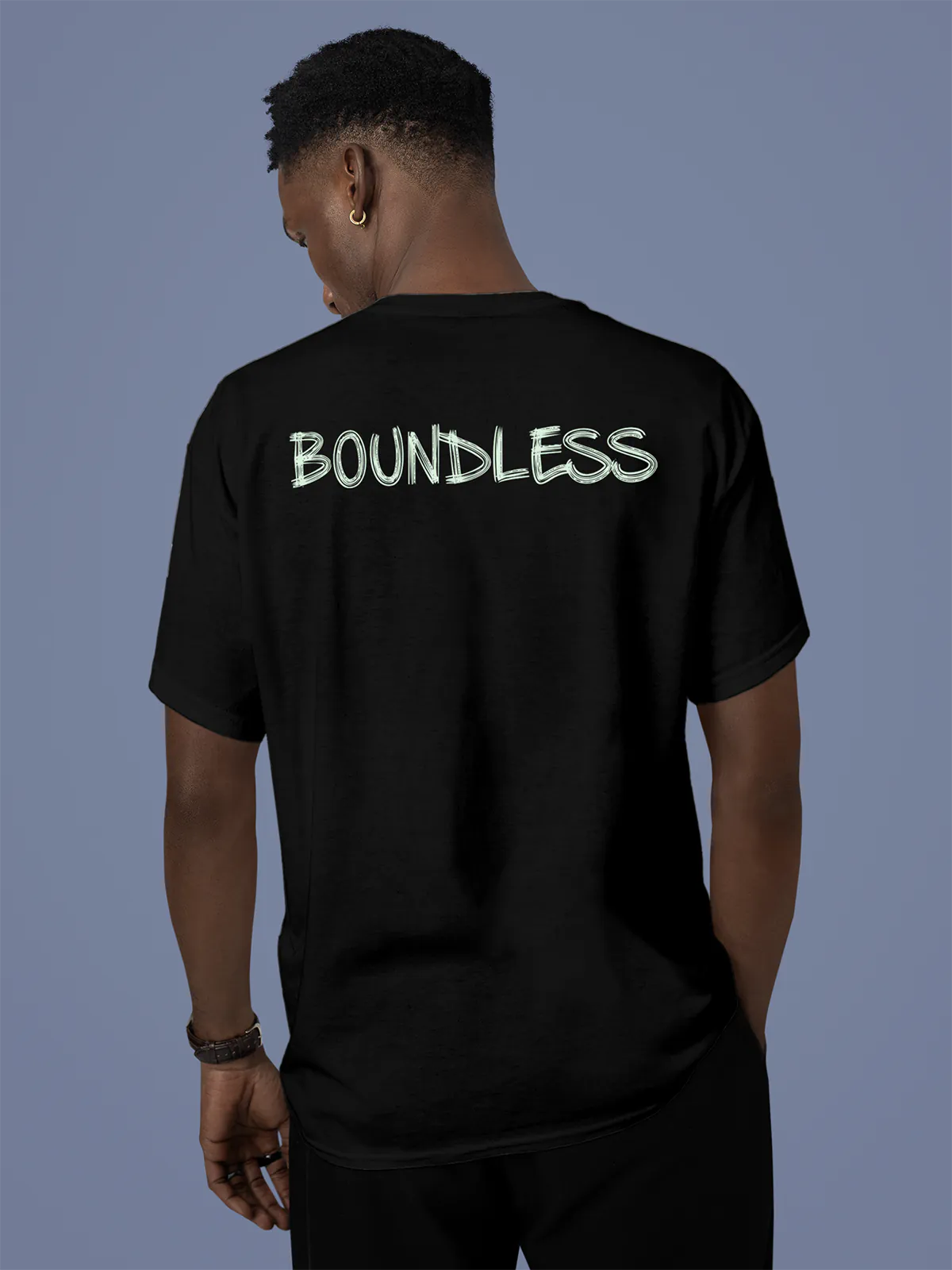 Model wearing Men's Black Round Neck T-shirt with 'Boundless' design, offering effortless style and premium comfort