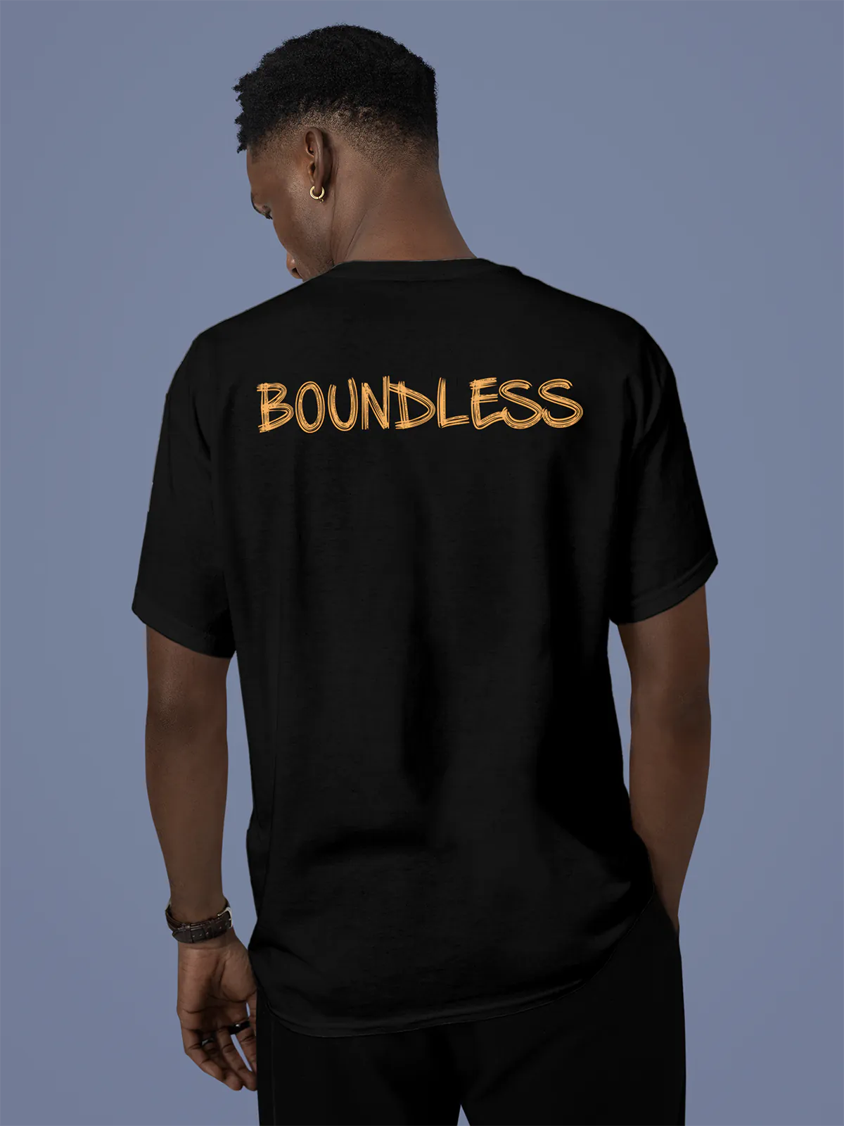 Model wearing Men's Black Round Neck T-shirt with 'Boundless' design, offering effortless style and premium comfort