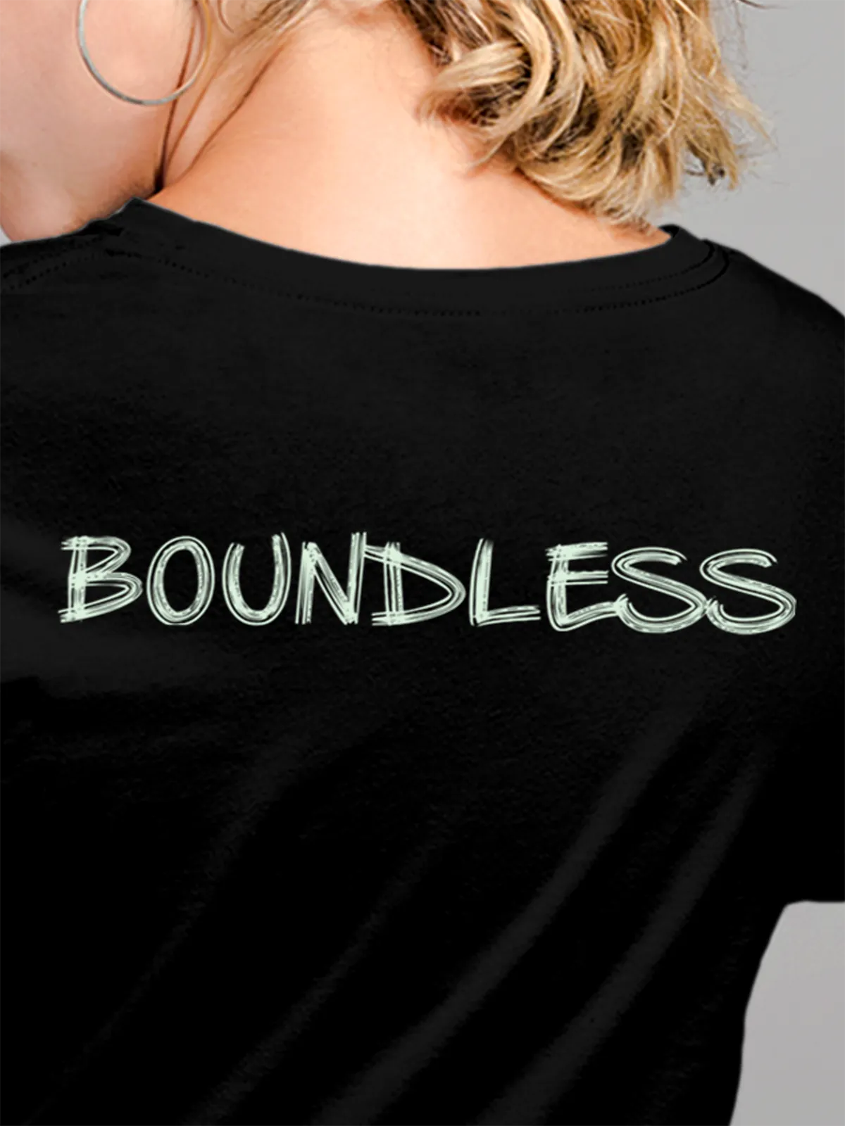 Close up of 'Boundless' design on Women's Black Round Neck T-shirt, highlighting intricate details and vibrant print.