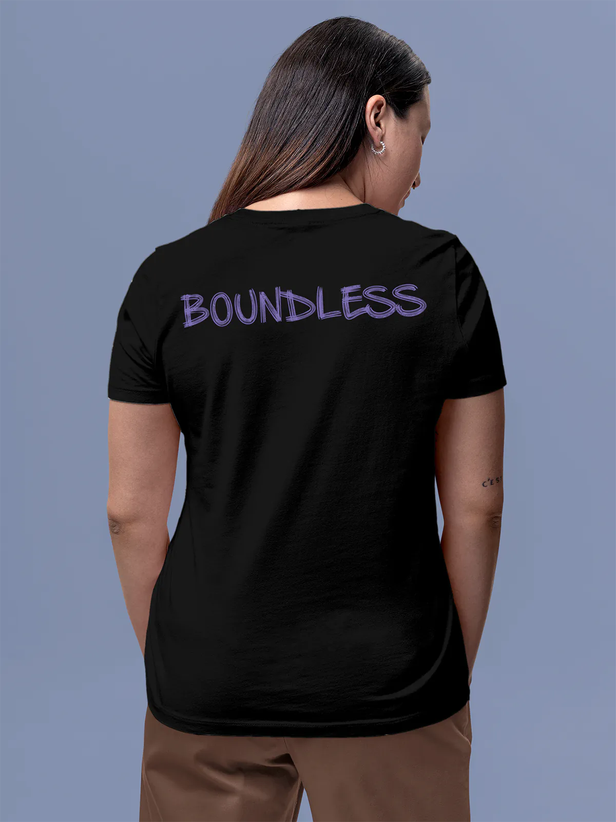 Model wearing Women's Black Round Neck T-shirt with 'Boundless' design, offering effortless style and premium comfort