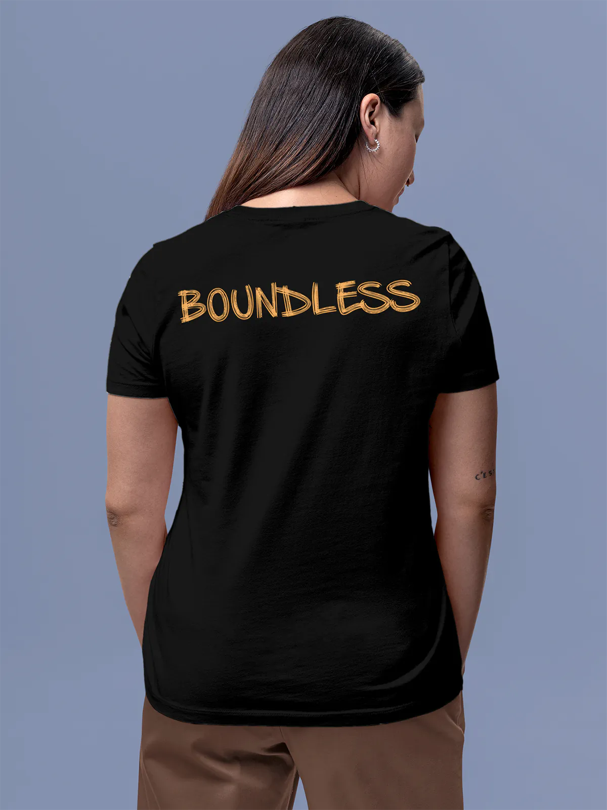 Model wearing Women's Black Round Neck T-shirt with 'Boundless' design, offering effortless style and premium comfort