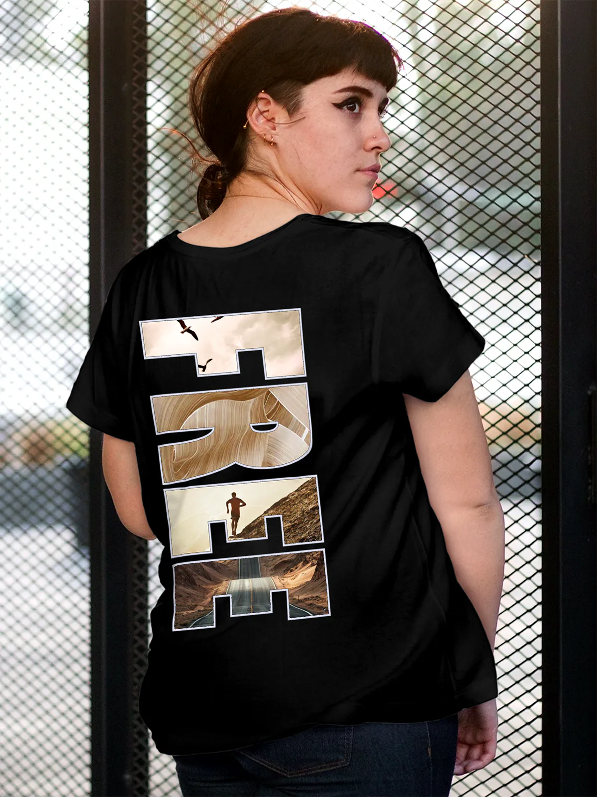 Model wearing Women's Black Round Neck T-shirt with 'Free & Boundless' design, offering effortless style and premium comfort