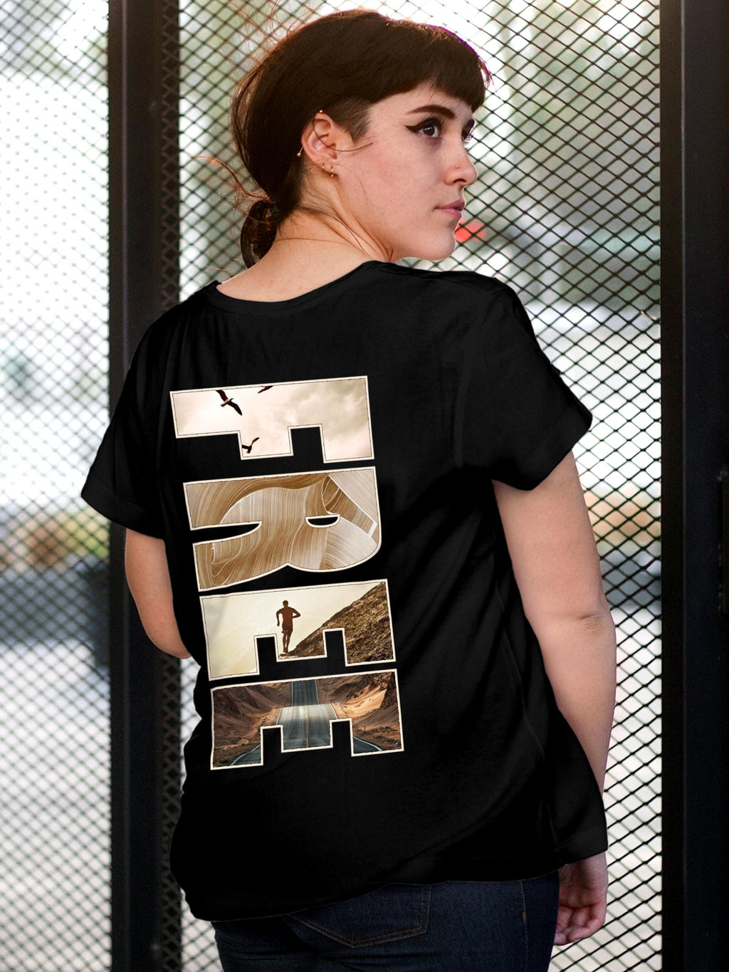 Model wearing Women's Black Round Neck T-shirt with 'Free & Boundless' design, offering effortless style and premium comfort