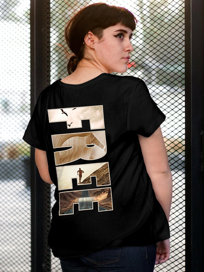 Model wearing Women's Black Round Neck T-shirt with 'Free & Boundless' design, offering effortless style and premium comfort