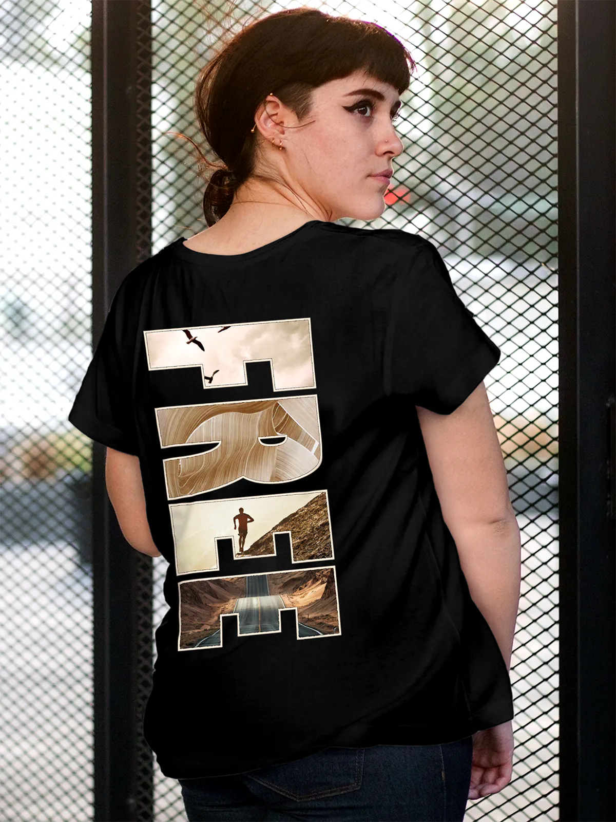 Model wearing Women's Black Round Neck T-shirt with 'Free & Boundless' design, offering effortless style and premium comfort