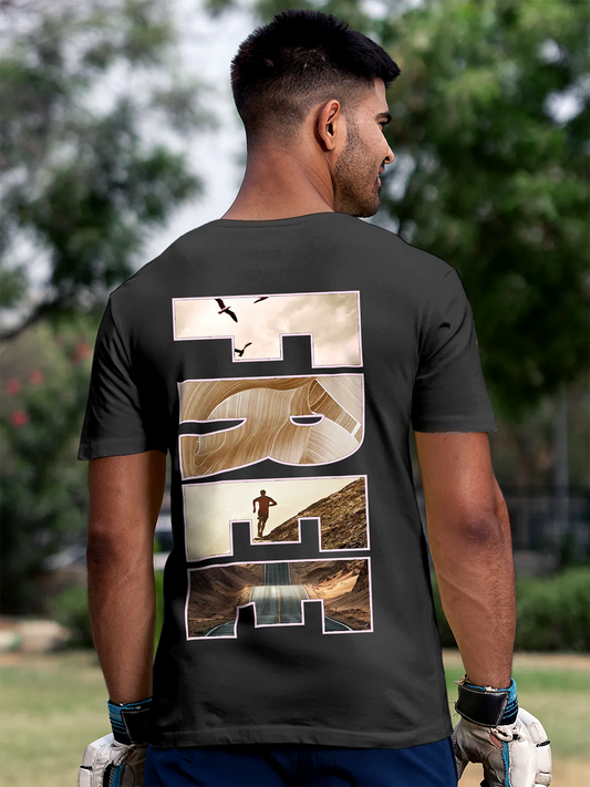 Fighterhero T-shirts: Model wearing Men's Dark Grey Round Neck T-shirt with 'Free & Boundless' design