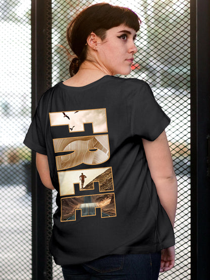 Model wearing Women's Dark Grey Round Neck T-shirt with 'Free & Boundless' design, offering effortless style and premium comfort