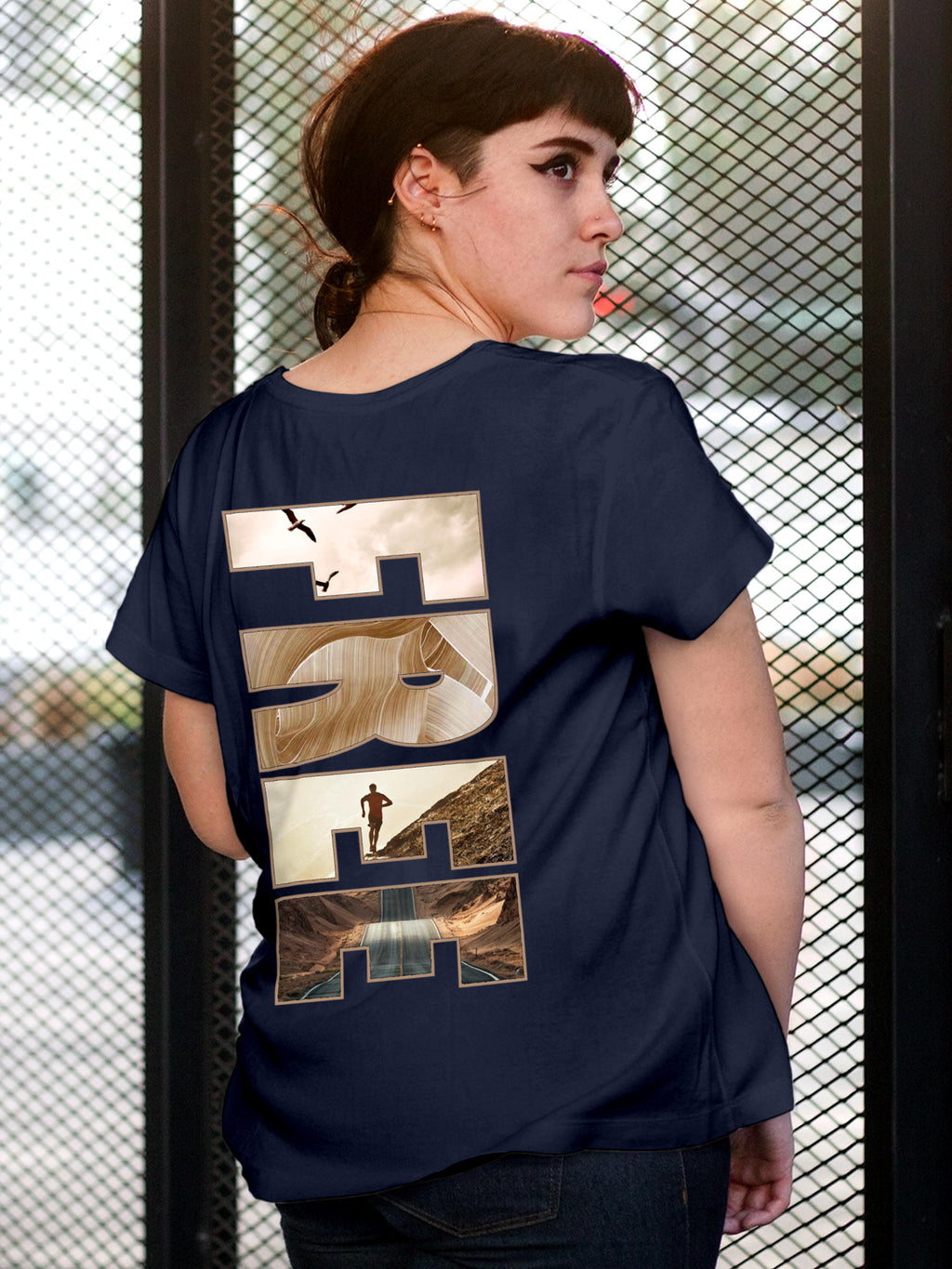 Model wearing Women's Navy Blue Round Neck T-shirt with 'Free & Boundless' design, offering effortless style and premium comfort