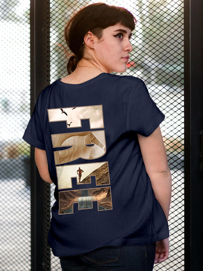 Model wearing Women's Navy Blue Round Neck T-shirt with 'Free & Boundless' design, offering effortless style and premium comfort
