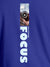 Close up of 'Focus' design on Women's Blue Round Neck T-shirt, highlighting intricate details and vibrant print.
