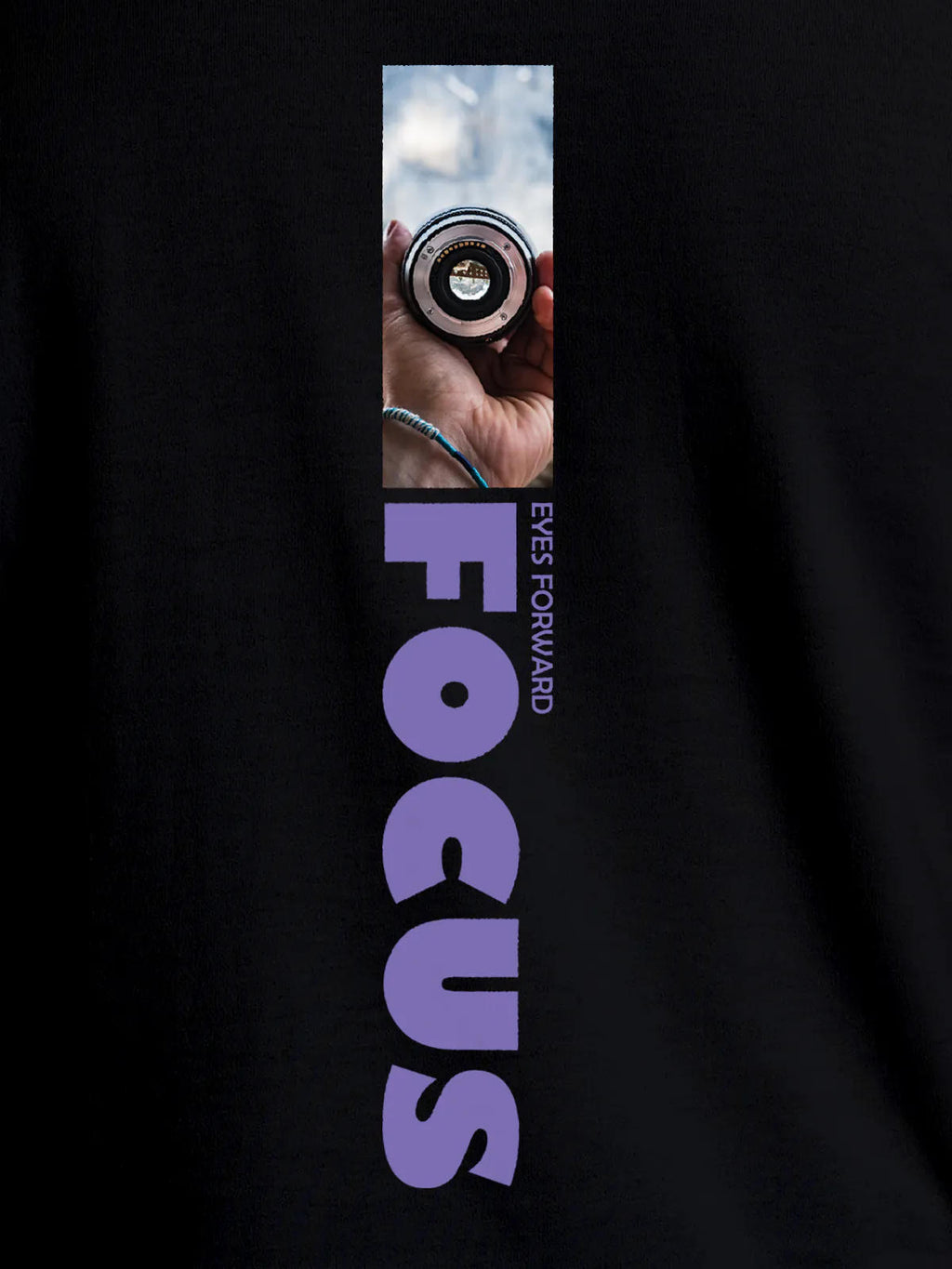 Close up of 'Focus' design on Women's Black Round Neck T-shirt, highlighting intricate details and vibrant print.