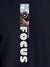 Close up of 'Focus' design on Men's Navy Blue Round Neck T-shirt, highlighting intricate details and vibrant print.