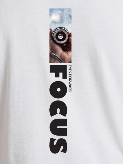 Close up of 'Focus' design on Women's White Round Neck T-shirt, highlighting intricate details and vibrant print.