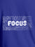 Close up of 'Focus In Chaos' design on Men's Blue Round Neck T-shirt, highlighting intricate details and vibrant print.
