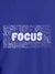 Close up of 'Focus In Chaos' design on Women's Blue Round Neck T-shirt, highlighting intricate details and vibrant print.