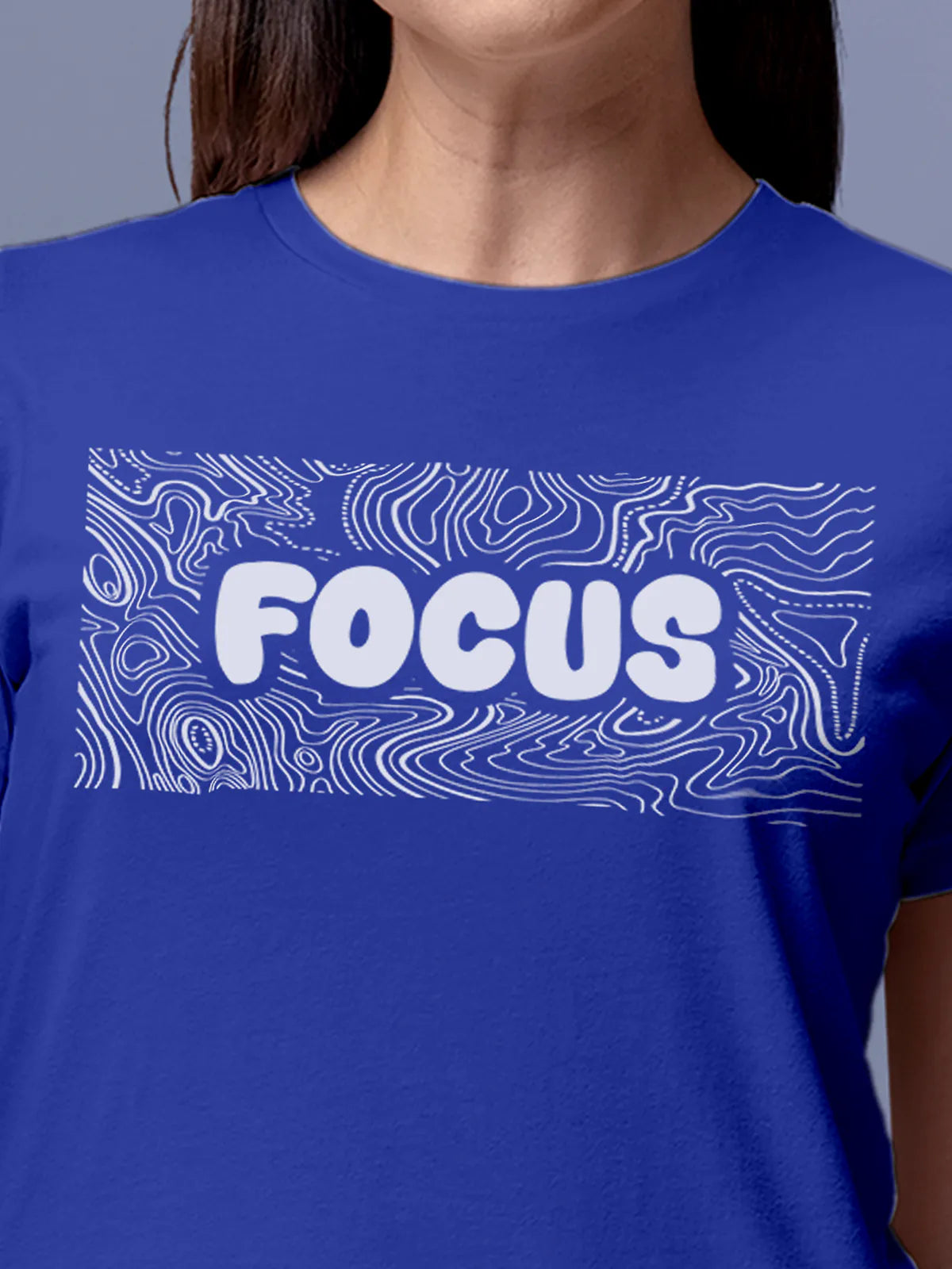 Close up of 'Focus In Chaos' design on Women's Blue Round Neck T-shirt, highlighting intricate details and vibrant print.