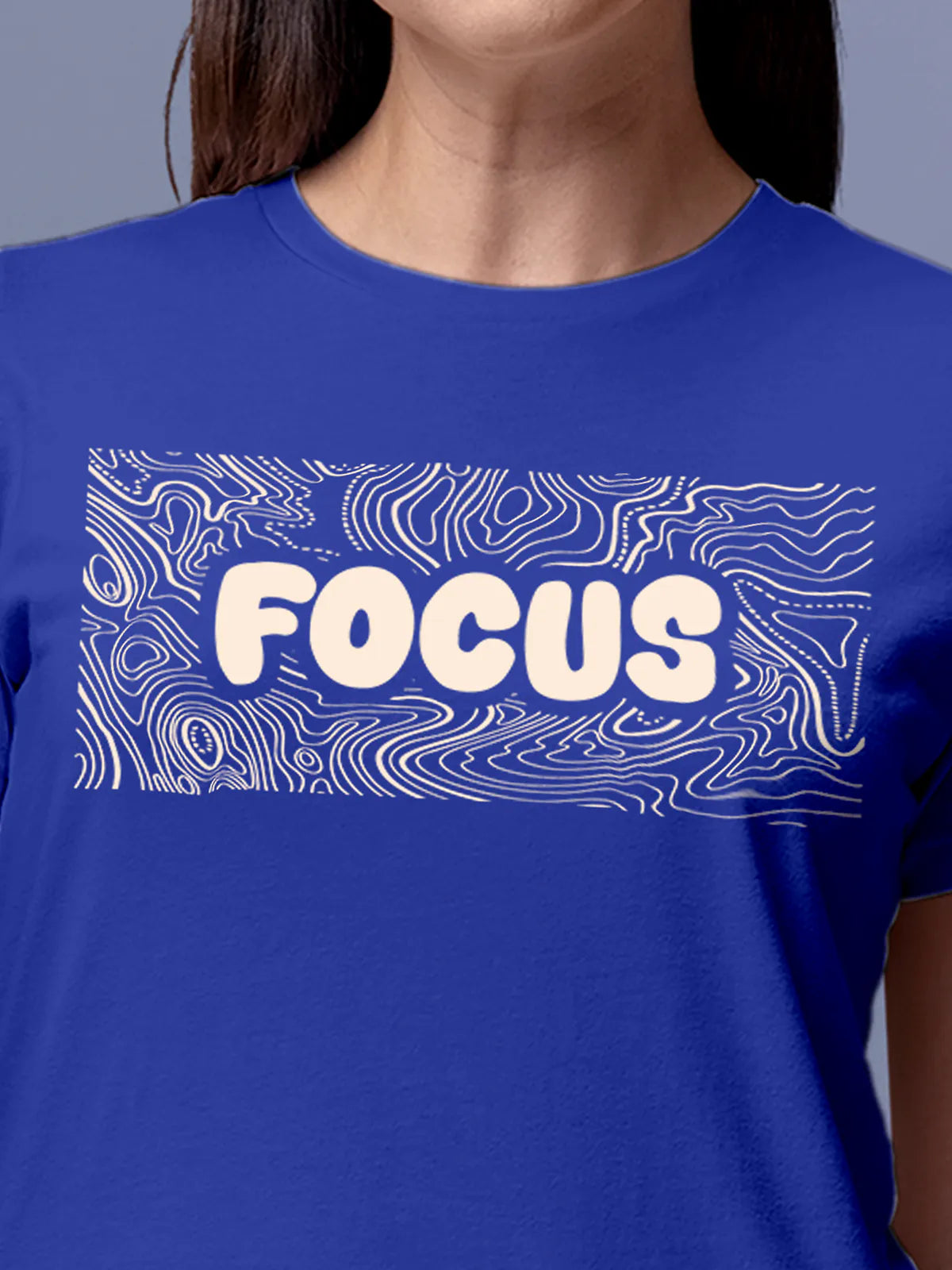 Close up of 'Focus In Chaos' design on Women's Blue Round Neck T-shirt, highlighting intricate details and vibrant print.