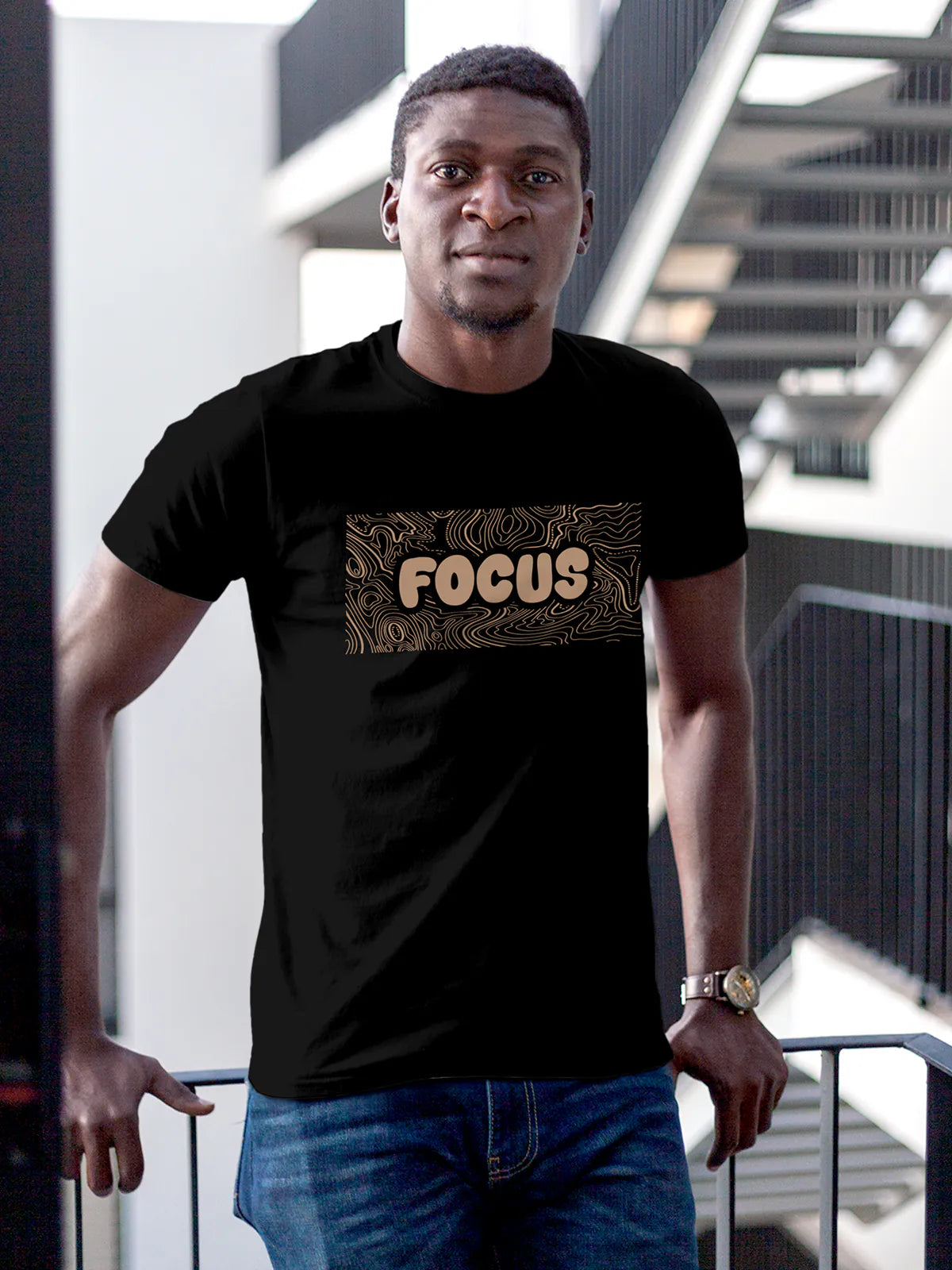 Model wearing Men's Black Round Neck T-shirt with 'Focus In Chaos' design, offering effortless style and premium comfort