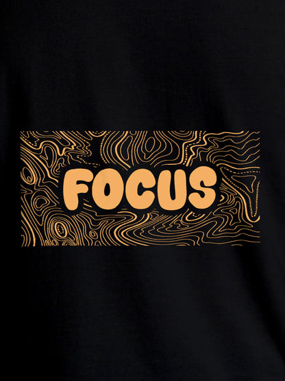 Close up of 'Focus In Chaos' design on Men's Black Round Neck T-shirt, highlighting intricate details and vibrant print.
