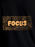 Close up of 'Focus In Chaos' design on Men's Black Round Neck T-shirt, highlighting intricate details and vibrant print.