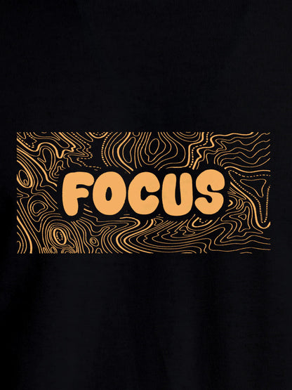 Close up of 'Focus In Chaos' design on Women's Black Round Neck T-shirt, highlighting intricate details and vibrant print.
