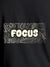 Close up of 'Focus In Chaos' design on Men's Dark Grey Round Neck T-shirt, highlighting intricate details and vibrant print.