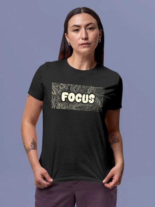 Model wearing Women's Dark Grey Round Neck T-shirt with 'Focus In Chaos' design, offering effortless style and premium comfort