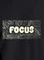 Close up of 'Focus In Chaos' design on Women's Dark Grey Round Neck T-shirt, highlighting intricate details and vibrant print.