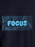 Close up of 'Focus In Chaos' design on Women's Navy Blue Round Neck T-shirt, highlighting intricate details and vibrant print.